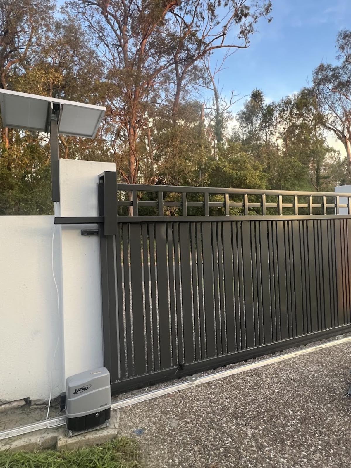 Aluminium slat sliding gate with solar-powered opener